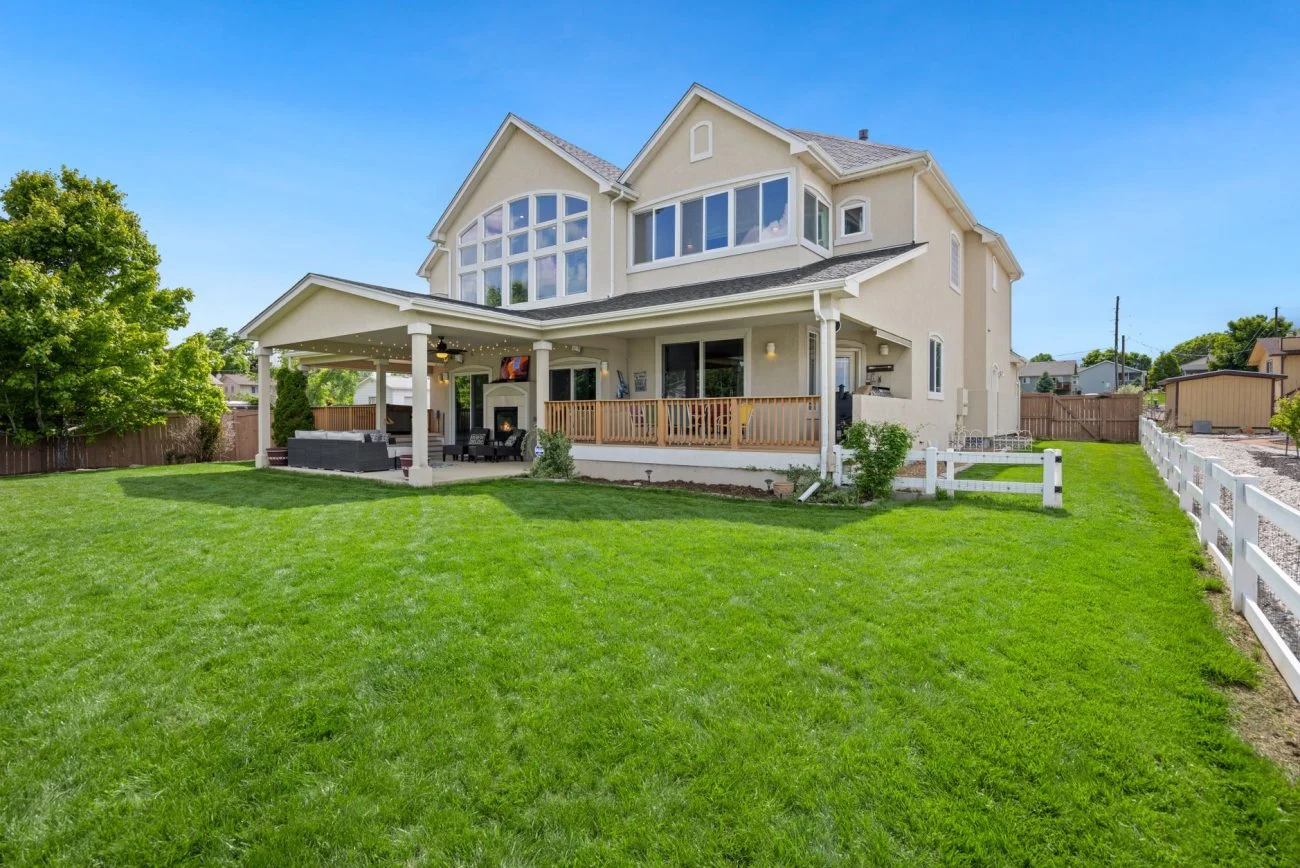 Two-story Eastside home with front porch and green lawn
